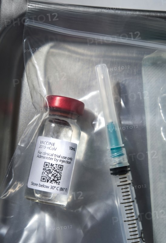 Covid-19 vaccine and syringe