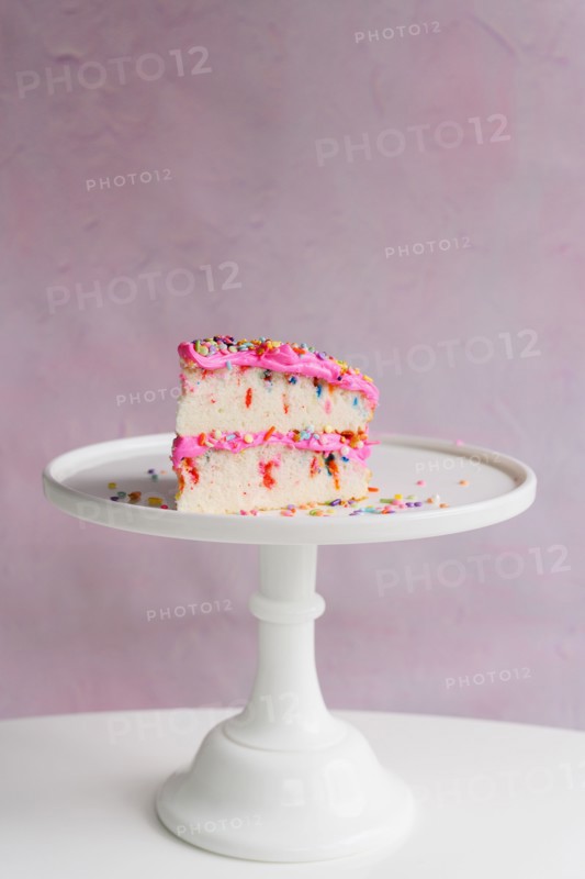Slice of festive cake on cake stand