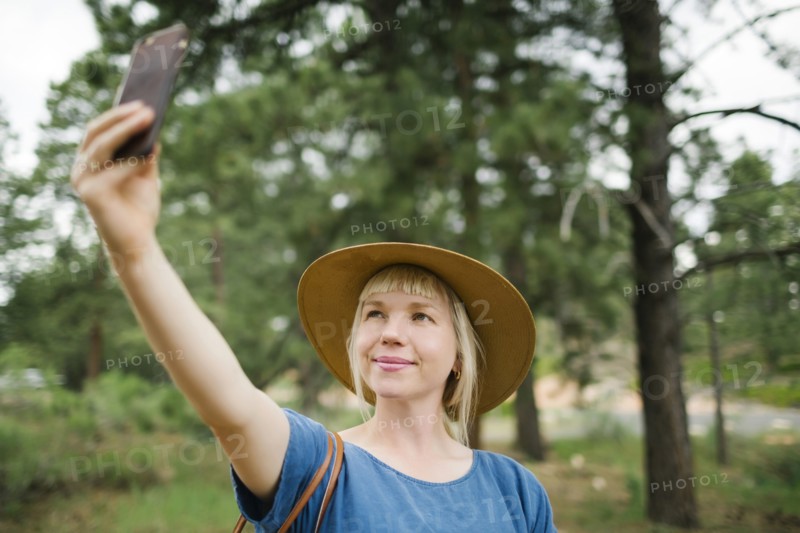 USA, Utah, Bryce Canyon, Woman taking selfie in national park