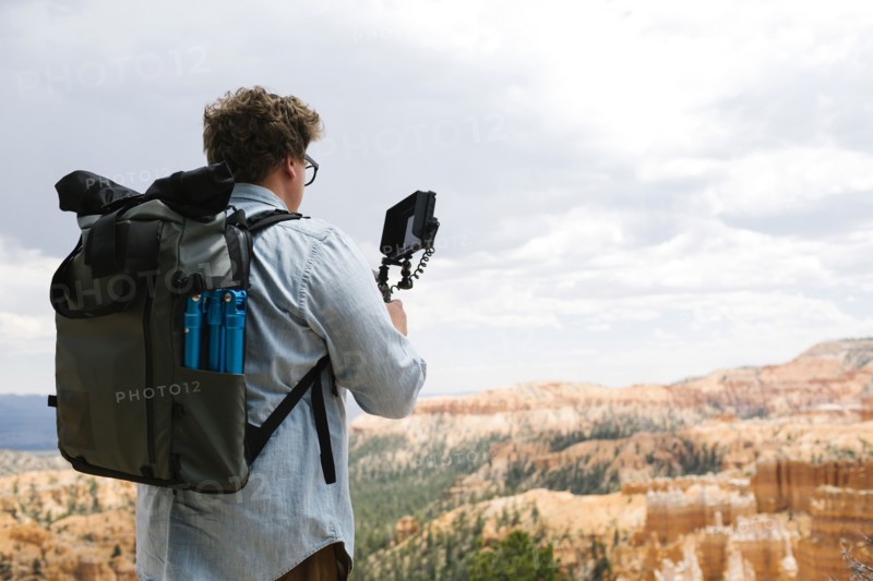 USA, Utah, Bryce Canyon, Man recording video in national park