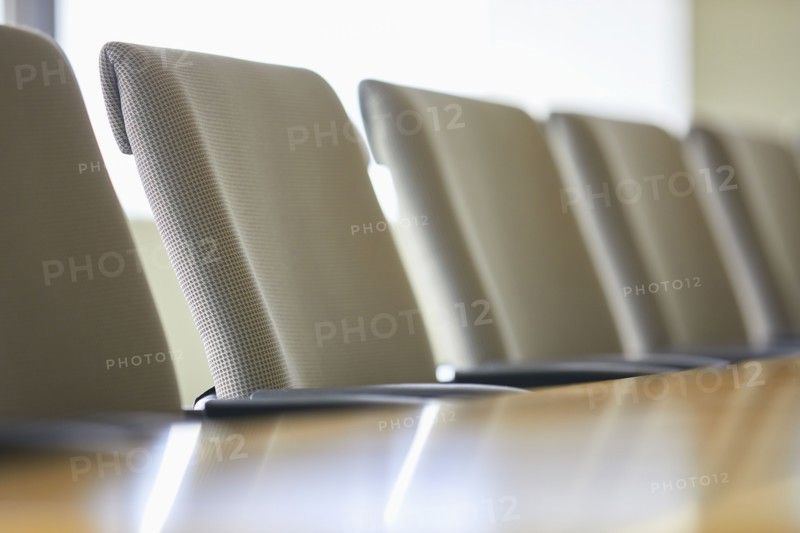 Office chairs in row at table