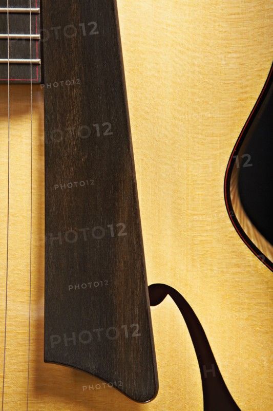 Close up of acoustic guitar saddle