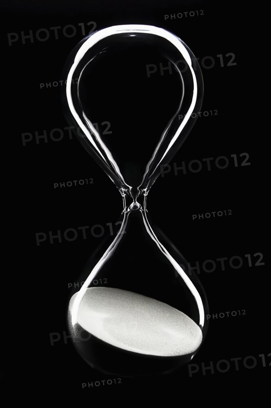 Hour glass on black background
