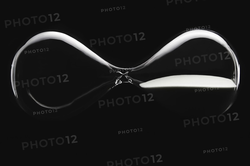 Hour glass on black background
