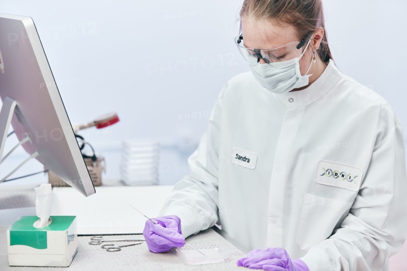 Female technician working with tests