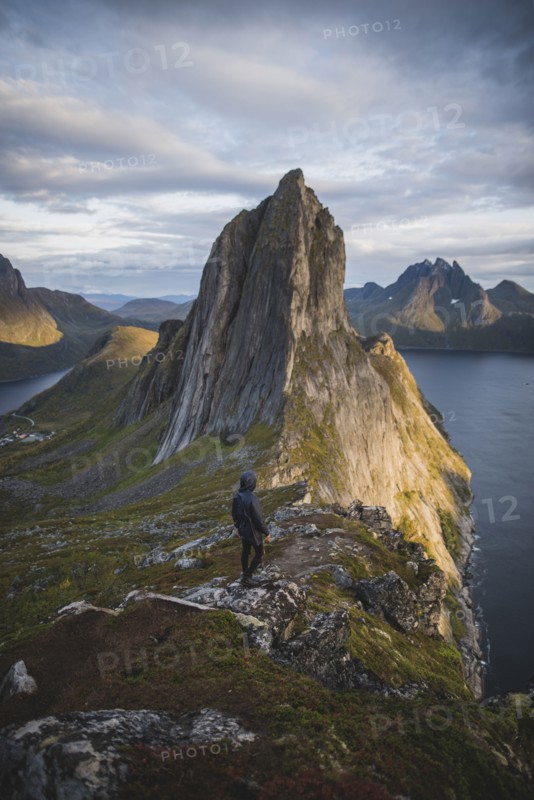Norway, Senja, Man hiking near Segla mountain