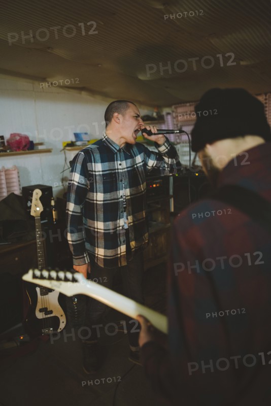 Young men during rehearsal in garage