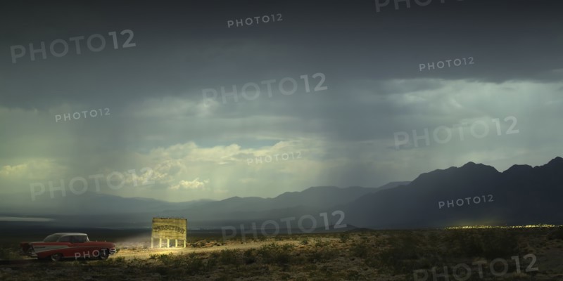 USA, Vintage car illuminating banner in desert