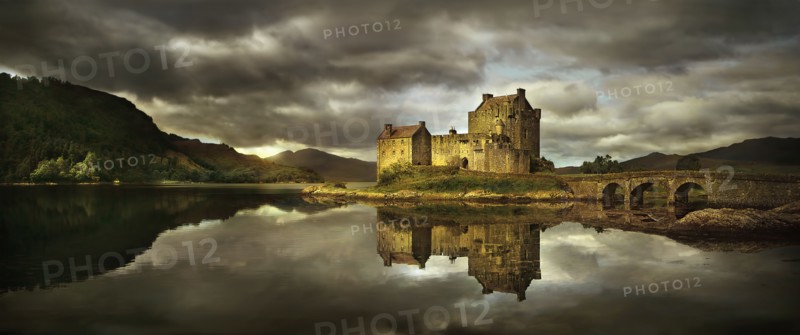 United Kingdom, Scotland, Medieval castle reflecting in lake