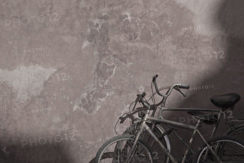 Morocco, Marrakesh, Two bicycles next to old wall