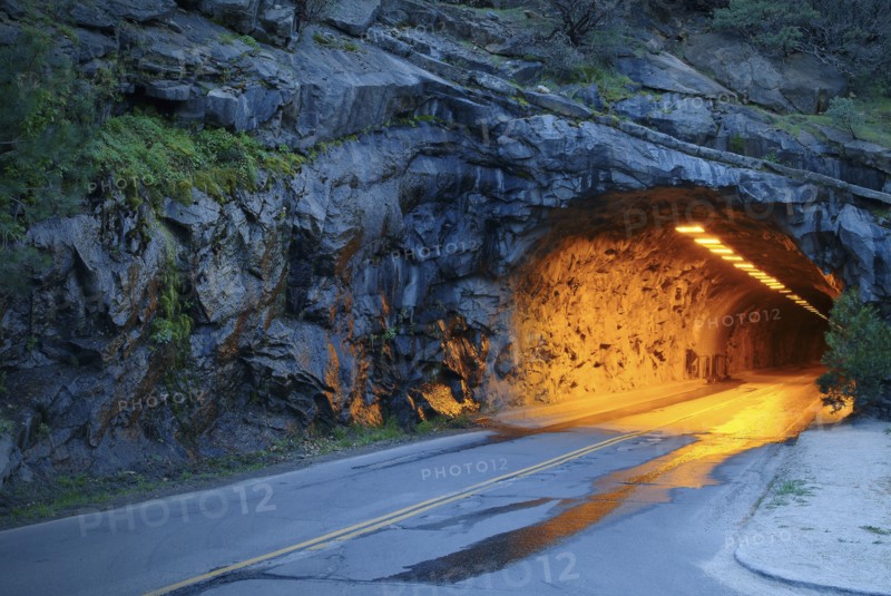 Illuminated tunnel in mountains