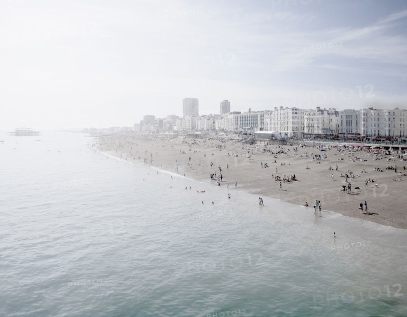 United Kingdom, England, Brighton, People resting at urban beach