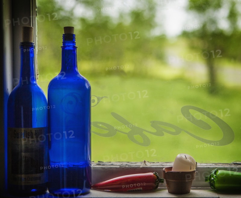 United Kingdom, England, Blue bottles on window sill