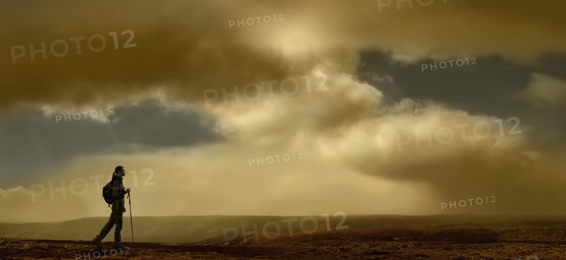 United Kingdom, Scotland, Lone hiker walking in mountains