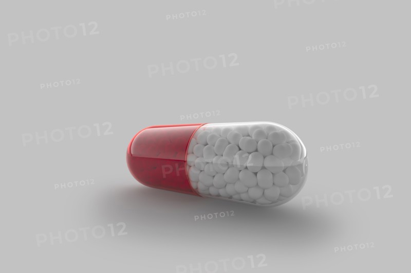 Studio shot of red and white capsule