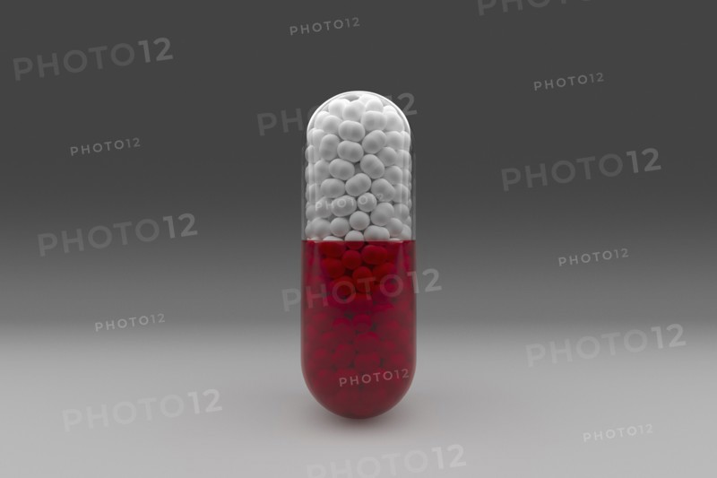 Studio shot of red and white capsule
