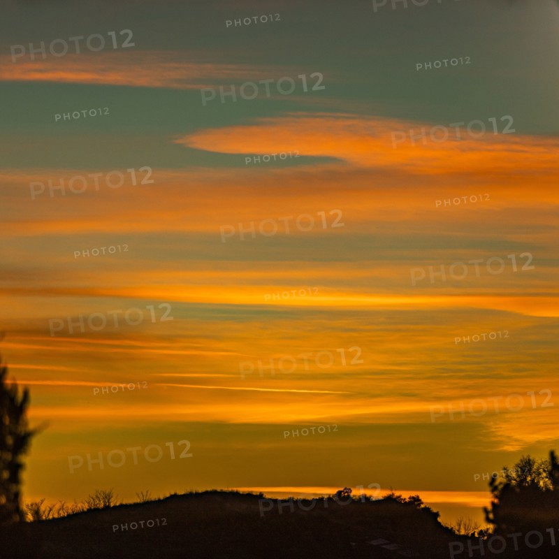 USA, Idaho, Boise, Orange sunset over hill