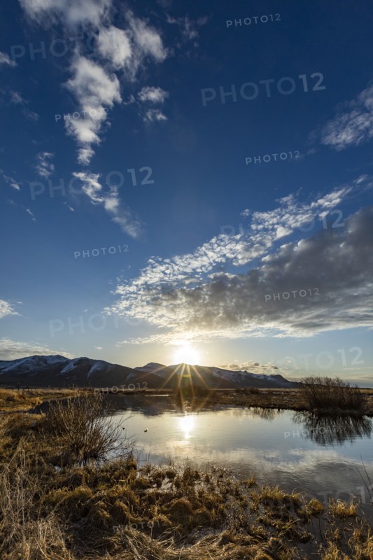 USA, Idaho, Sun Valley, Sunrise reflected in water
