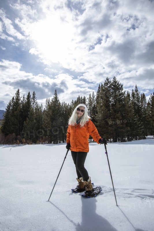 USA, Idaho, Sun Valley, Woman snowshoeing in winter landscape