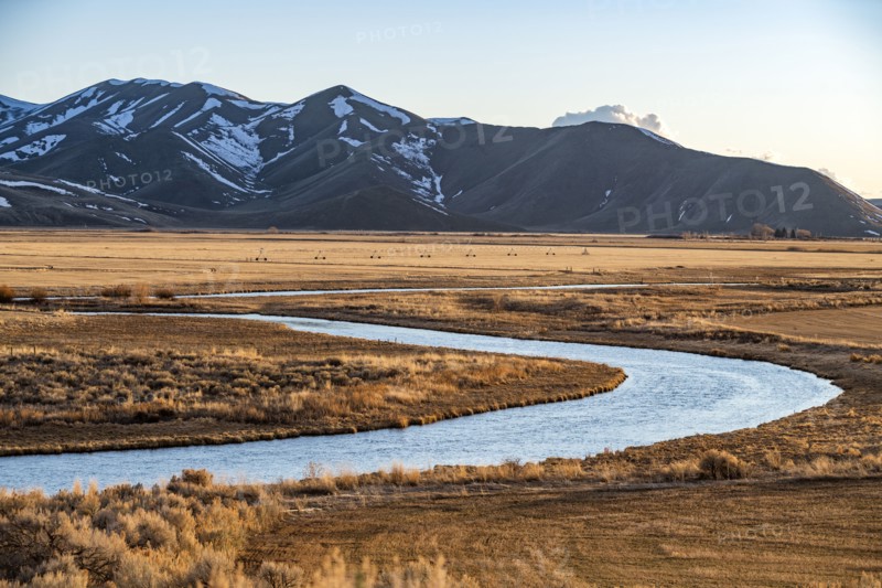 USA, Idaho, Picabo, Landscape with Silver Creek fields and mountain range