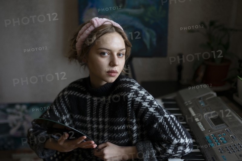 Portrait of mid adult woman at home