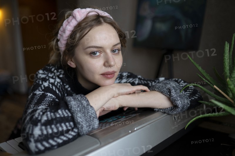 Portrait of mid adult woman at home