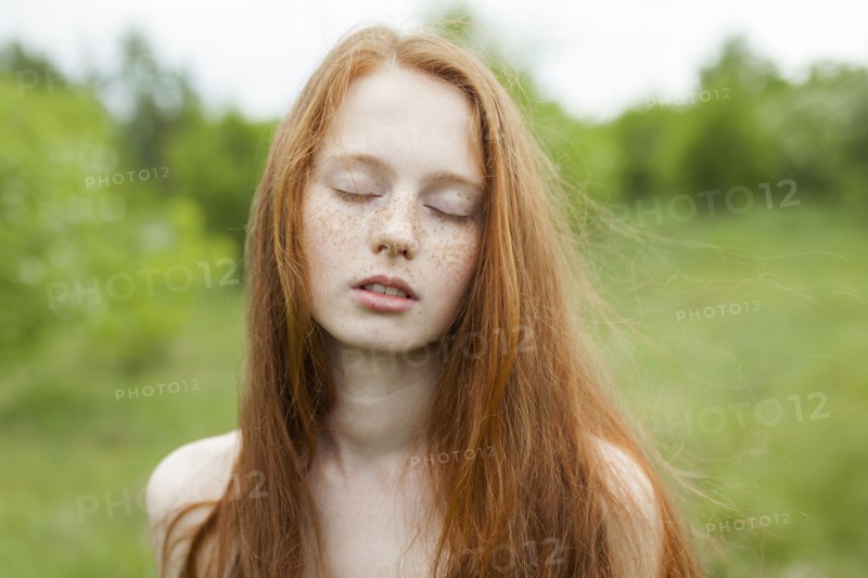 Portrait of teenage girl with red hair