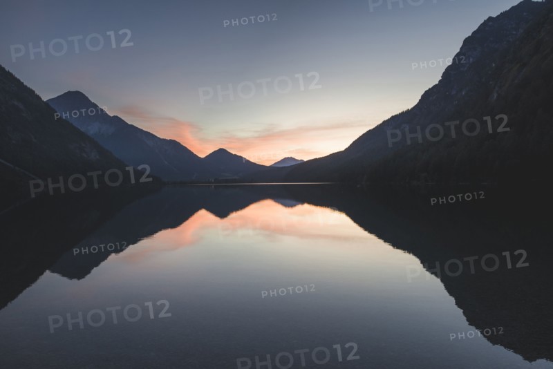 Austria, Plansee, Lake Heiterwanger in Austrian Alps in sunrise