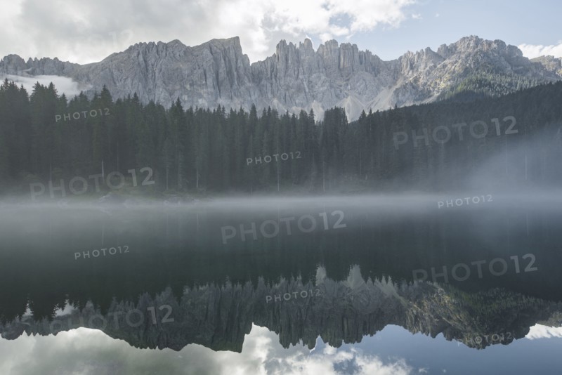 Italy, Carezza, Lago di Carezza in Dolomite Alps at dawn