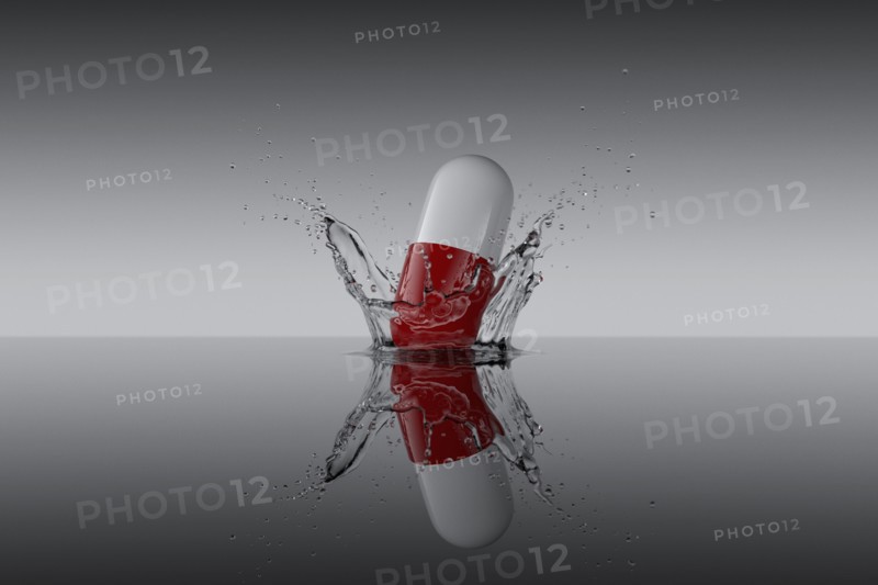 Studio shot of red and white capsule