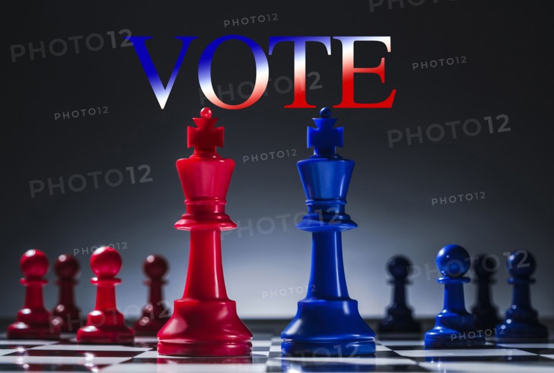 Studio shot of red and blue chess pawns symbolizing US Democratic and Republican parties
