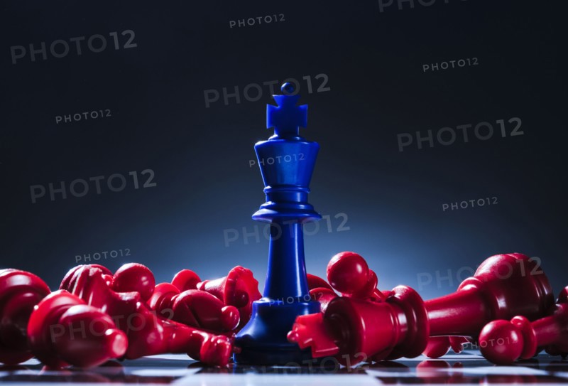 Studio shot of red and blue chess pawns symbolizing US Democratic and Republican parties
