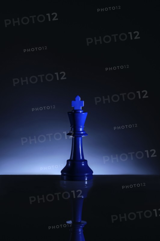 Studio shot of blue chess king