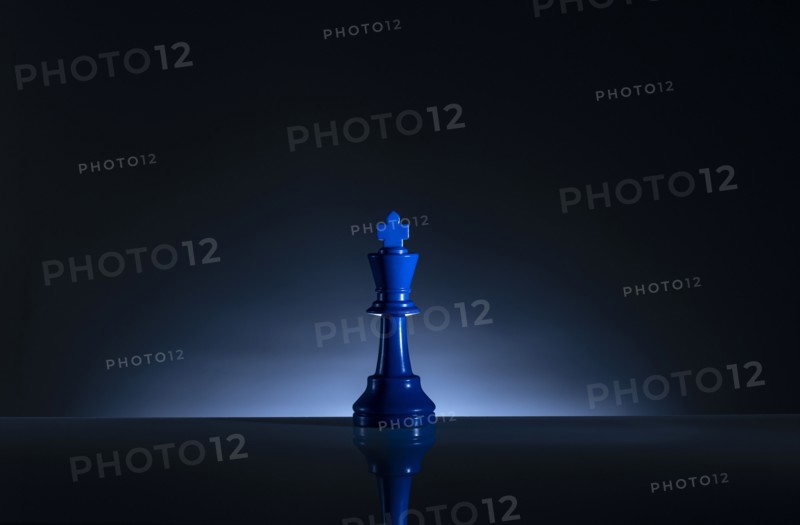 Studio shot of blue chess king