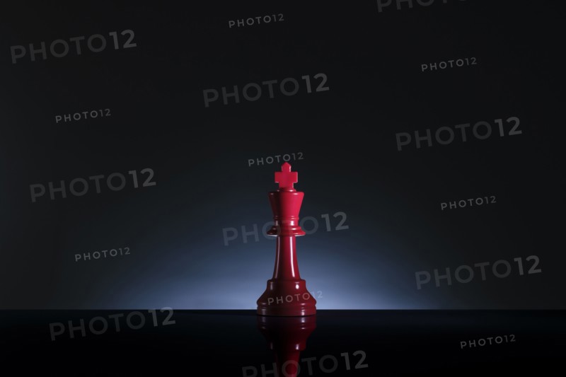Studio shot of red chess king
