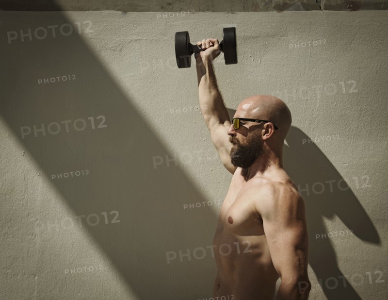 Man exercising with dumbbell