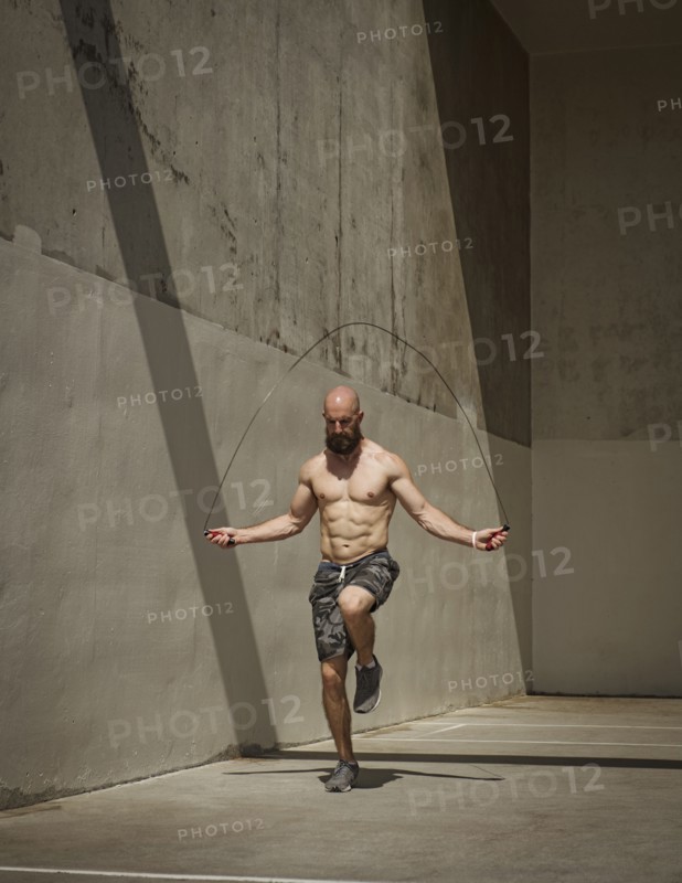 Man exercising with jumping rope