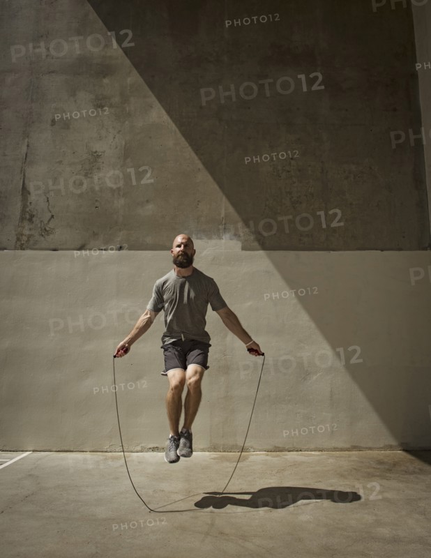 Man exercising with jumping rope