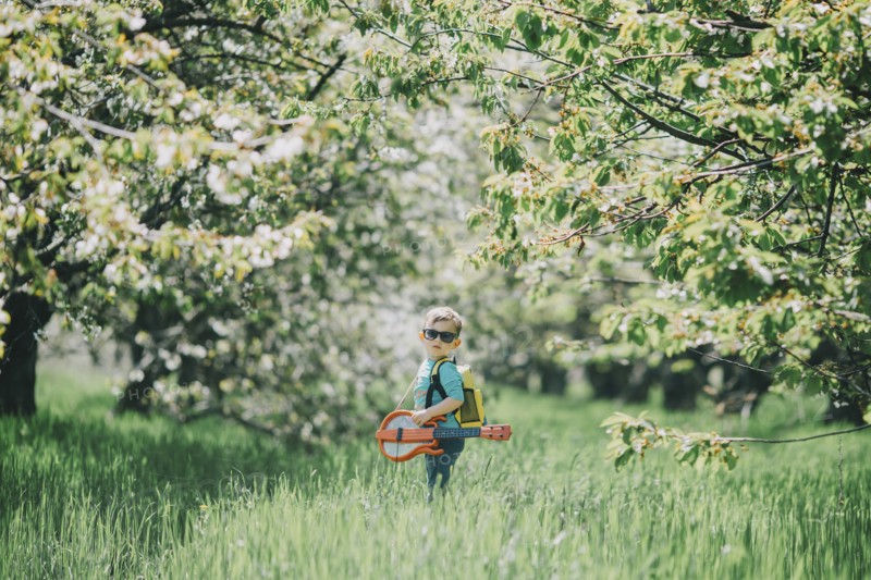 Boy (2-3) in orchard