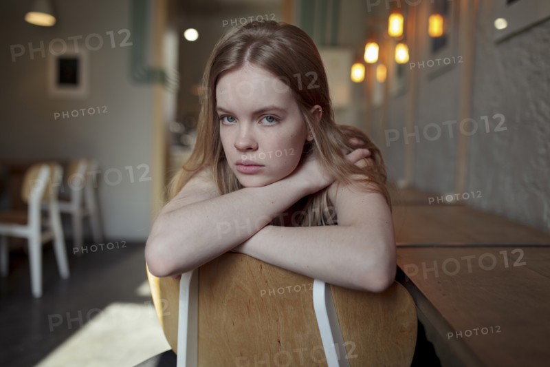 Portrait of young woman with long blond hair