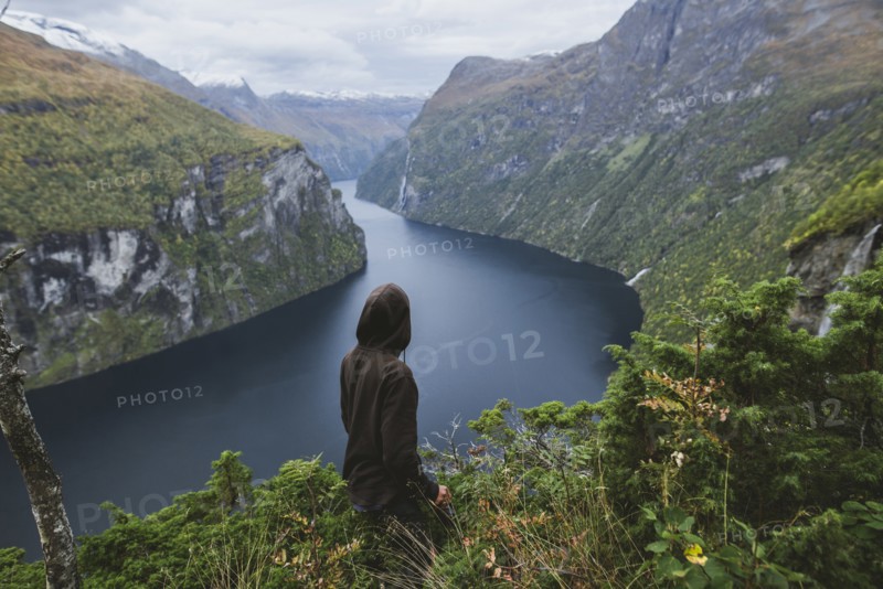 Norway, Geiranger, Man looking at scenic view of Geirangerfjord