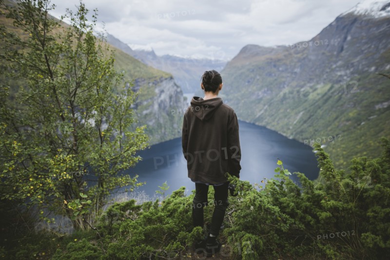 Norway, Geiranger, Man looking at scenic view of Geirangerfjord
