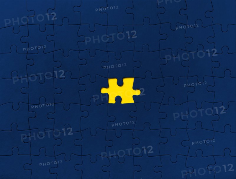 Yellow puzzle on blue background,,