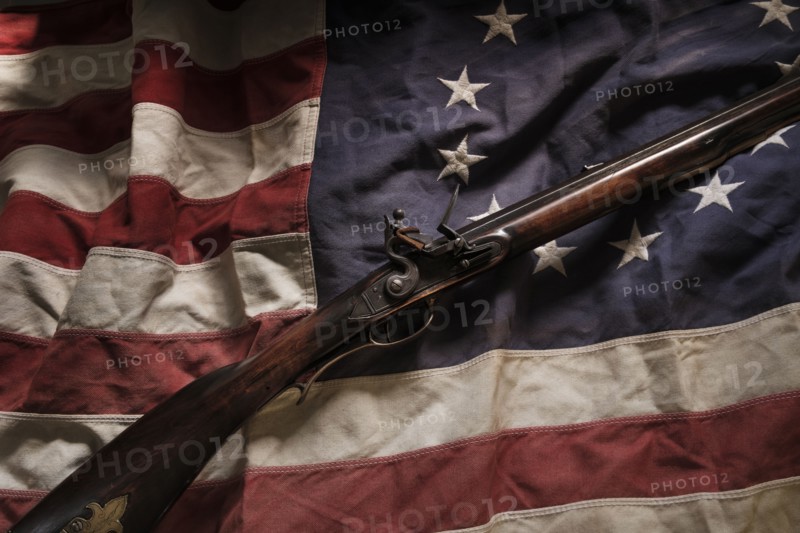 Rifle lying on American flag