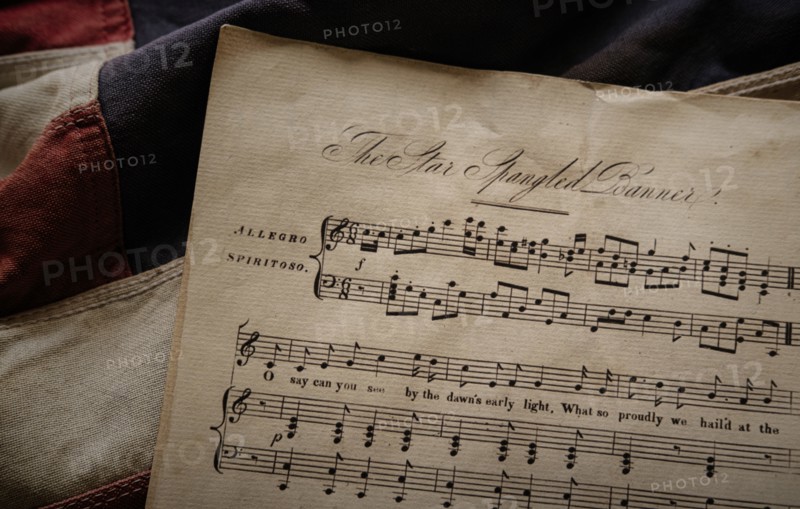 Music notation of US anthem on American flag