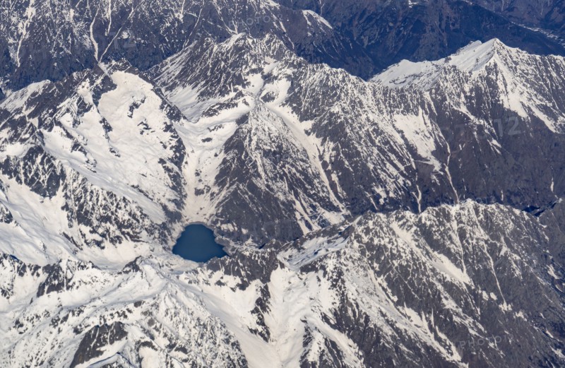 Switzerland, Canton Wallis, Lake among snowy mountains