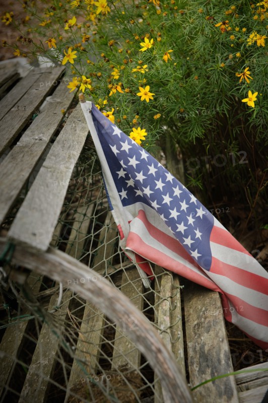 Faded American flag on old wood,,