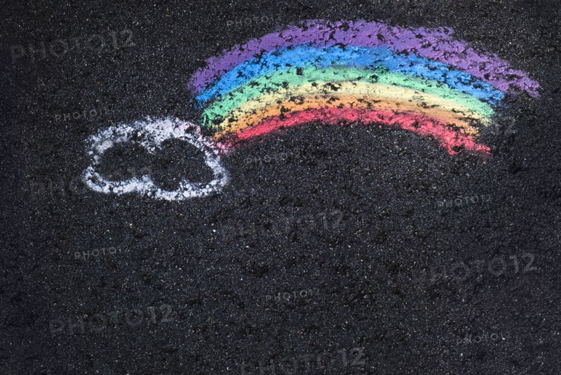Childs chalk drawing with cloud and rainbow