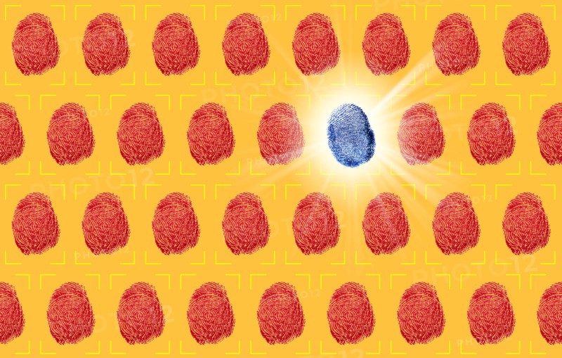 One blue fingerprint between red fingerprints on yellow background
