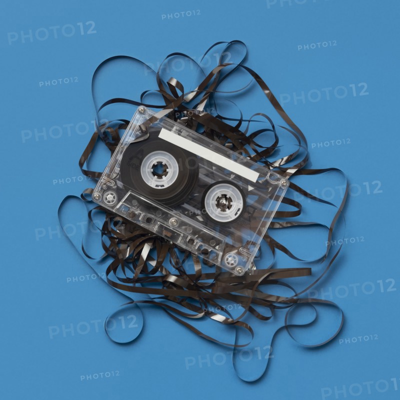 Analog audio cassette on blue background